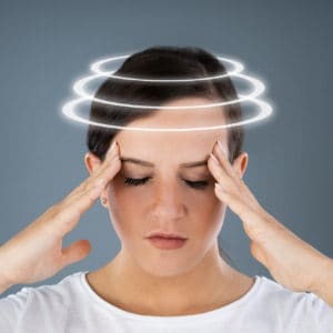 Woman Suffering From Headache Dizziness
