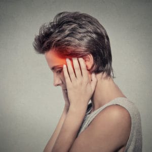 side profile sick female having ear pain headache. Tinnitus.