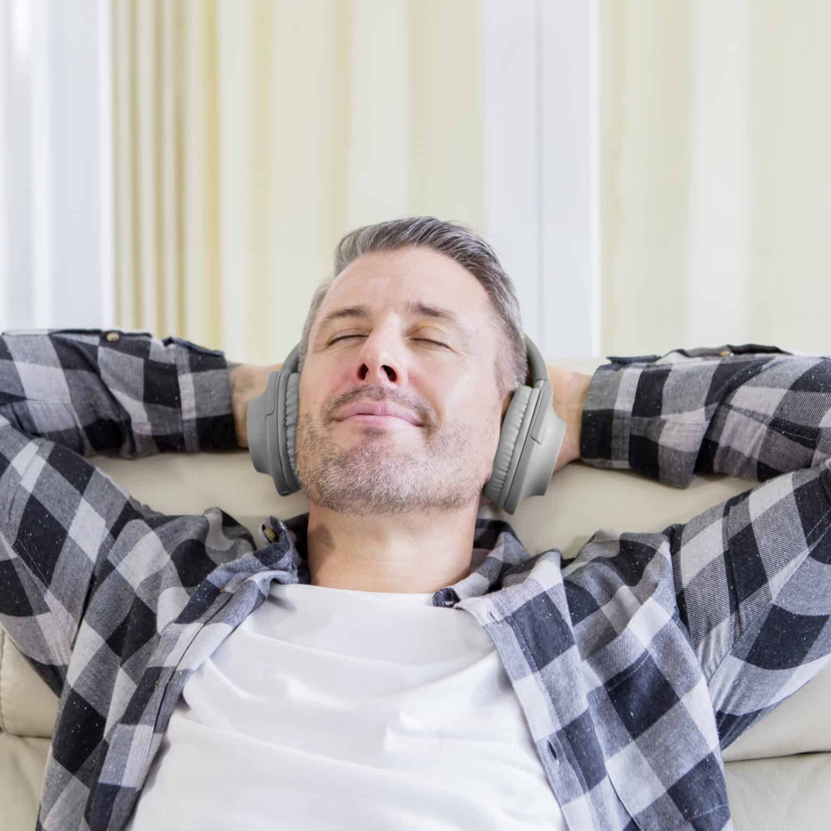 Young man enjoying music with headphones