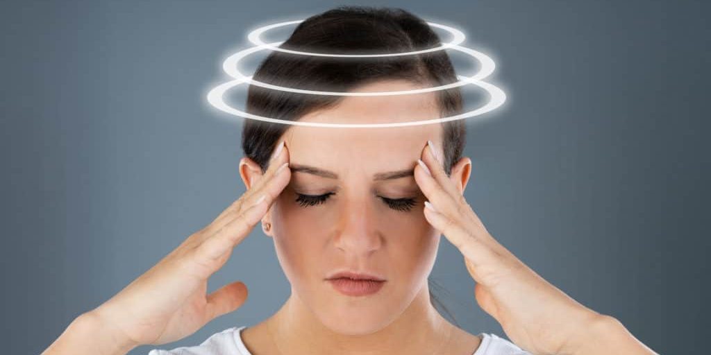 Woman Suffering From Headache Dizziness